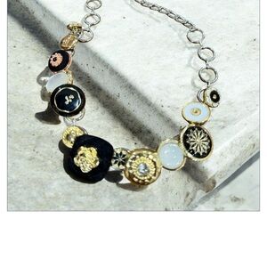 Elegant Gold and Black Button Necklace